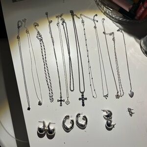 12 necklaces and 5 pair of earrings silver color.